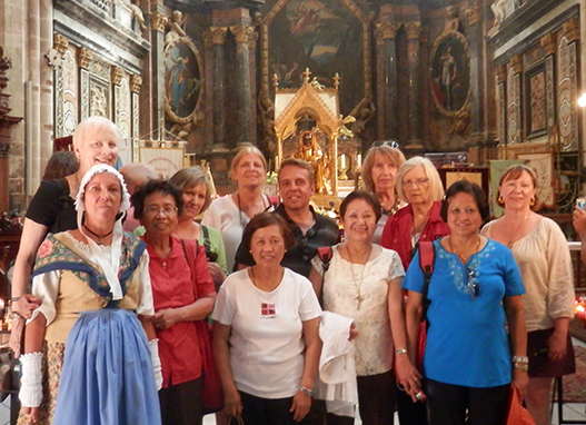 Photo in front of skull of St. Mary Magdalene