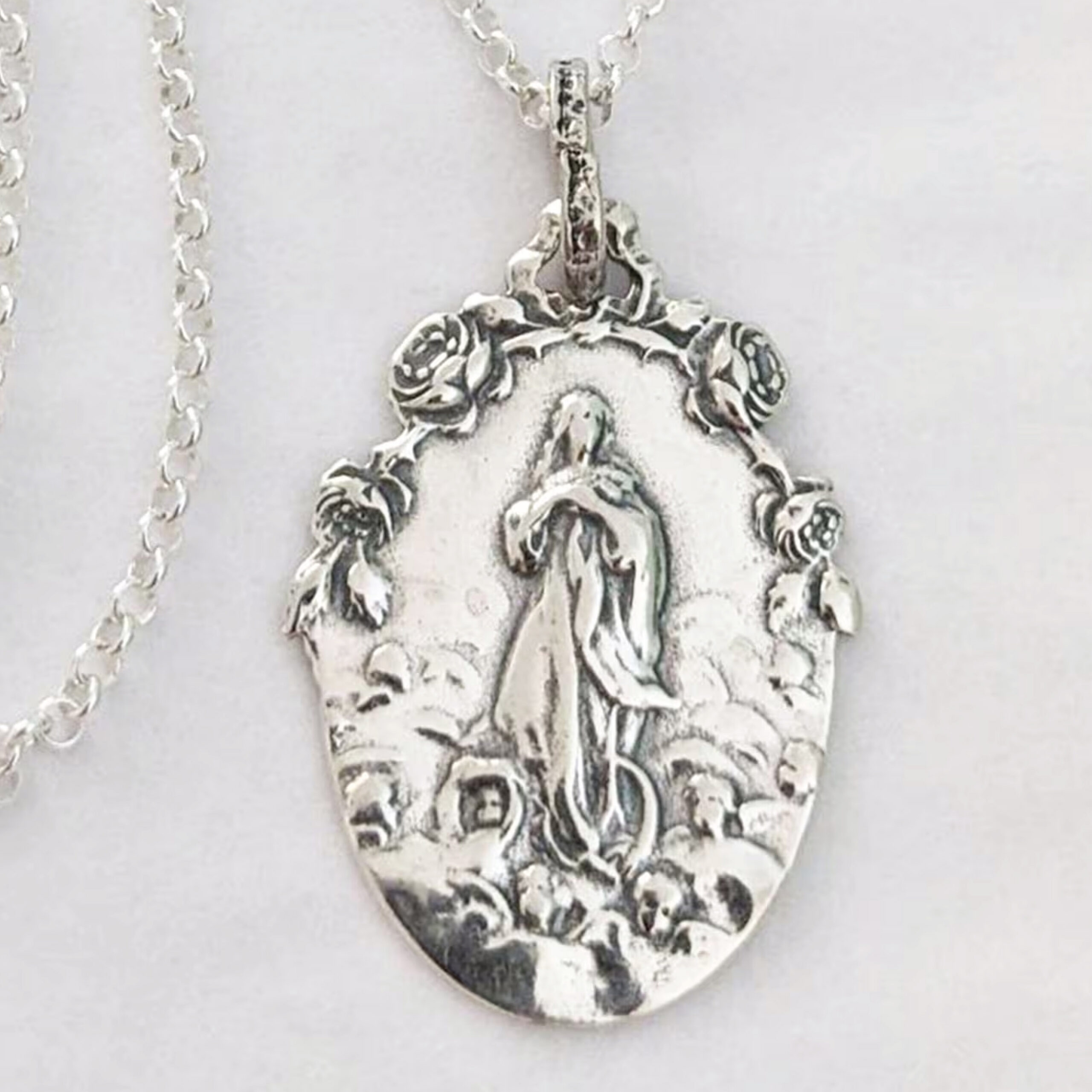 Mary Magdalene carried by angels medal